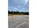 Image shows a construction site with the ground prepared for a new building at 59 Pine Vista Way, Sanford, NC 27332