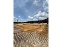 Image shows a construction site with the foundation laid for a new building at 59 Pine Vista Way, Sanford, NC 27332