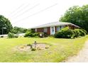 Charming single-story brick home with a well-manicured lawn and lovely landscaping at 728,720 S Wakefield St, Zebulon, NC 27597