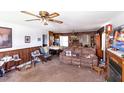 Spacious living room featuring wood paneling and a cozy fireplace at 728,720 S Wakefield St, Zebulon, NC 27597
