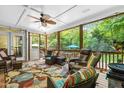 Cozy screened porch featuring comfortable wicker furniture and view of the backyard at 7401 Heartland Dr, Wake Forest, NC 27587