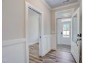 Bright foyer featuring wood-look floors, white trim and natural light at 1062 Beacon Hill Rd # 45, Lillington, NC 27546