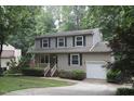 Beautifully maintained two-story home with a single-car garage and mature landscaping at 116 Trinity Woods Dr, Raleigh, NC 27607