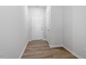 Bright entryway with hardwood floors and a modern interior door at 135 Central Townes Way # 305, Raleigh, NC 27603