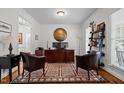 Bright home office featuring an organized workspace, stylish decor, and a patterned area rug at 1412 Kings Lassiter Way, Raleigh, NC 27614