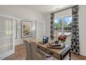 Inviting home office with French doors, large window and natural light at 180 Babbling Creek Dr, Youngsville, NC 27596