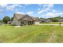 Well-maintained home featuring a landscaped yard, two-car garage and sidewalk at 235 Camden Place St, Princeton, NC 27569