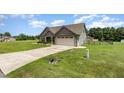 Well-maintained home featuring a landscaped yard, two-car garage and long driveway at 235 Camden Place St, Princeton, NC 27569