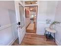 Bright entryway featuring wood-look floors, paneled walls and an open view into the living area at 523 Beacon Hill Rd # 31, Lillington, NC 27546