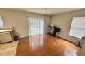 Bright dining area with wood floors and sliding glass doors to the backyard at 6005 Namozine Ct, Raleigh, NC 27610