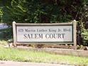 Signage for Salem Court reads 875 Martin Luther King Jr. Blvd in weathered wooden frame at 875 Mlk Jr Boulevard,15, Chapel Hill, NC 27516