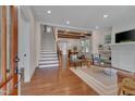 Open-concept home featuring hardwood floors, a fireplace, and an open dining area at 924 W Trinity Ave, Durham, NC 27701