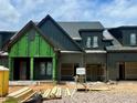 A townhouse in construction featuring an attached two-car garage at 1025 Coldspring Circle, Durham, NC 27705