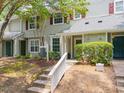 Charming townhome entrance with inviting walkway and well-maintained landscaping, perfect for curb appeal at 105 Sir Richard Ln, Chapel Hill, NC 27517