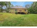 Expansive backyard with a wooden deck, ideal for outdoor entertaining and recreation at 109 Springwood Dr, Wake Forest, NC 27587