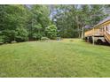 Spacious backyard with a fire pit area, perfect for outdoor gatherings and relaxation at 109 Springwood Dr, Wake Forest, NC 27587