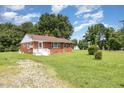 Traditional brick house with inviting front entrance and manicured lawn, a perfect Gathering home at 1209 Bobbitt Dr, Garner, NC 27529