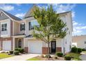 Charming townhome featuring an attached garage, a well maintained lawn and delightful front yard landscaping at 1217 Trilogy Blvd # 174, Morrisville, NC 27560