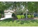 A beautifully landscaped front yard with lush greenery frames this charming home at 150 Churchill Rd, Louisburg, NC 27549