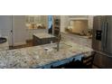 Spacious kitchen with granite countertops, stainless steel appliances, double islands, and custom cabinetry at 1512 Obrien Cir, Wake Forest, NC 27587