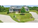 Well-maintained front yard featuring lush lawn and landscaping that enhances the curb appeal of this inviting home at 216 Tarkenton Ct, Clayton, NC 27527
