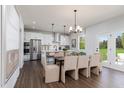 Bright, open dining area connecting to a modern kitchen with island at 226 Macon Lake Drive # 41, Apex, NC 27523