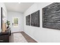 Inviting entryway with modern art, wood floors, and decorative wallpaper at 226 Macon Lake Drive # 41, Apex, NC 27523