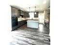 Modern kitchen featuring an island, stainless appliances, stylish cabinetry, and eat-in nook at 2661 Bowden Dr, Creedmoor, NC 27522