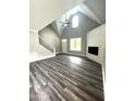 Bright, spacious living room featuring vaulted ceilings, fireplace, and modern flooring at 2661 Bowden Dr, Creedmoor, NC 27522