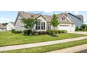 Charming single-Gathering home with a well-kept lawn, mature trees, and a convenient two-car garage at 3333 Jones Lake Rd, Fuquay Varina, NC 27526