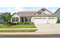 Inviting single-Gathering home featuring a well-maintained lawn, landscaping, and a convenient two-car garage at 3333 Jones Lake Rd, Fuquay Varina, NC 27526