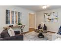 Comfortable living room with stylish decor, hardwood floors, and an open doorway to adjacent spaces at 604 Mills St, Raleigh, NC 27608