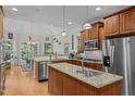 Well-equipped kitchen features granite countertops, stainless steel appliances, and ample cabinet space at 109 San Juan Dr, Chapel Hill, NC 27514
