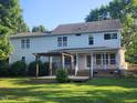 Expansive back of house with large windows, a deck, and a pergola at 133 Rustic Ln, Smithfield, NC 27577