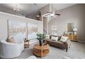 Inviting living room featuring a high ceiling, cozy seating, and stylish decor at 2060 Jersey City Pl, Apex, NC 27523