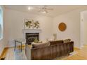 Inviting living room with fireplace, seating, hardwood floors, and neutral decor at 244 Sweet Bay Pl, Carrboro, NC 27510