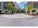 Street view showcasing the neighborhood and its landscaped walkways between apartment buildings at 2813 Market Bridge Ln # 104, Raleigh, NC 27608
