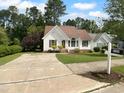 Inviting single Gathering home with beautiful front yard, long driveway, and lush green lawn at 3509 Neptune Dr, Raleigh, NC 27604