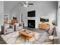 Bright living room with vaulted ceiling, fireplace, and stylish furniture at 3509 Neptune Dr, Raleigh, NC 27604