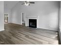 Spacious living room with fireplace and hardwood floors, ready for customization at 3509 Neptune Dr, Raleigh, NC 27604