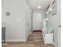 Inviting foyer with wood-look floors and a built-in bench at 4401 Lyman Ave, Raleigh, NC 27616