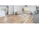 Bright living room with wood-look floors and neutral decor at 4401 Lyman Ave, Raleigh, NC 27616
