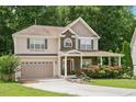 Well maintained traditional home, stone accents, attached garage and mature landscaping at 517 Wheddon Cross Way, Wake Forest, NC 27587