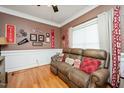 Cozy living area featuring comfortable seating and decorative movie-themed accents at 517 Wheddon Cross Way, Wake Forest, NC 27587