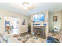 Comfortable living room with fireplace and modern entertainment setup at 54 Lockwood Dr, Clayton, NC 27527
