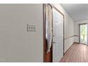 Hallway has a closet and leads to a space with natural light at 5520 Kaplan Dr, Raleigh, NC 27606