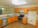 Kitchen featuring stainless steel appliances, granite countertops, and wood cabinets at 1098 Blackstone Dr, Creedmoor, NC 27522