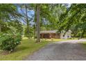 Charming home with brick accents, mature trees and gravel driveway at 1139 Princeton Kenly Rd, Kenly, NC 27542
