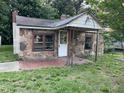 Close-up of the exterior stone facade and front porch of the home at 1521 Lewis St, Rocky Mount, NC 27804