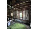 Interior with exposed studs, wooden floor, and cinder block foundation at 1521 Lewis St, Rocky Mount, NC 27804